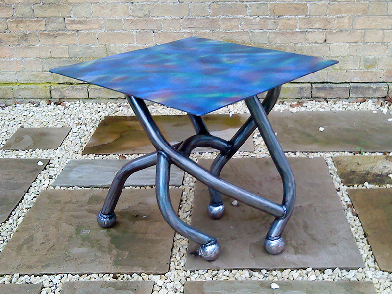 The Boule Chair - Contemporary metal table created from metal tubing and petanque balls with painted top