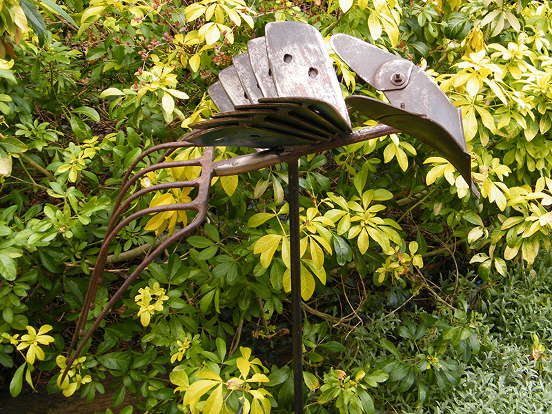 The Ridger - Metal bird sculpture created from farming implements
